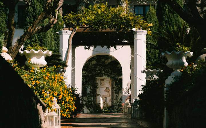 House with a gate and trees in front