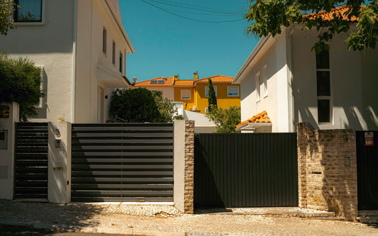 Metal gates at the entrance of two homes